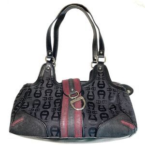 Etienne Aigner leather
 purse w/zipper and magnetic latch closure. 3 sections